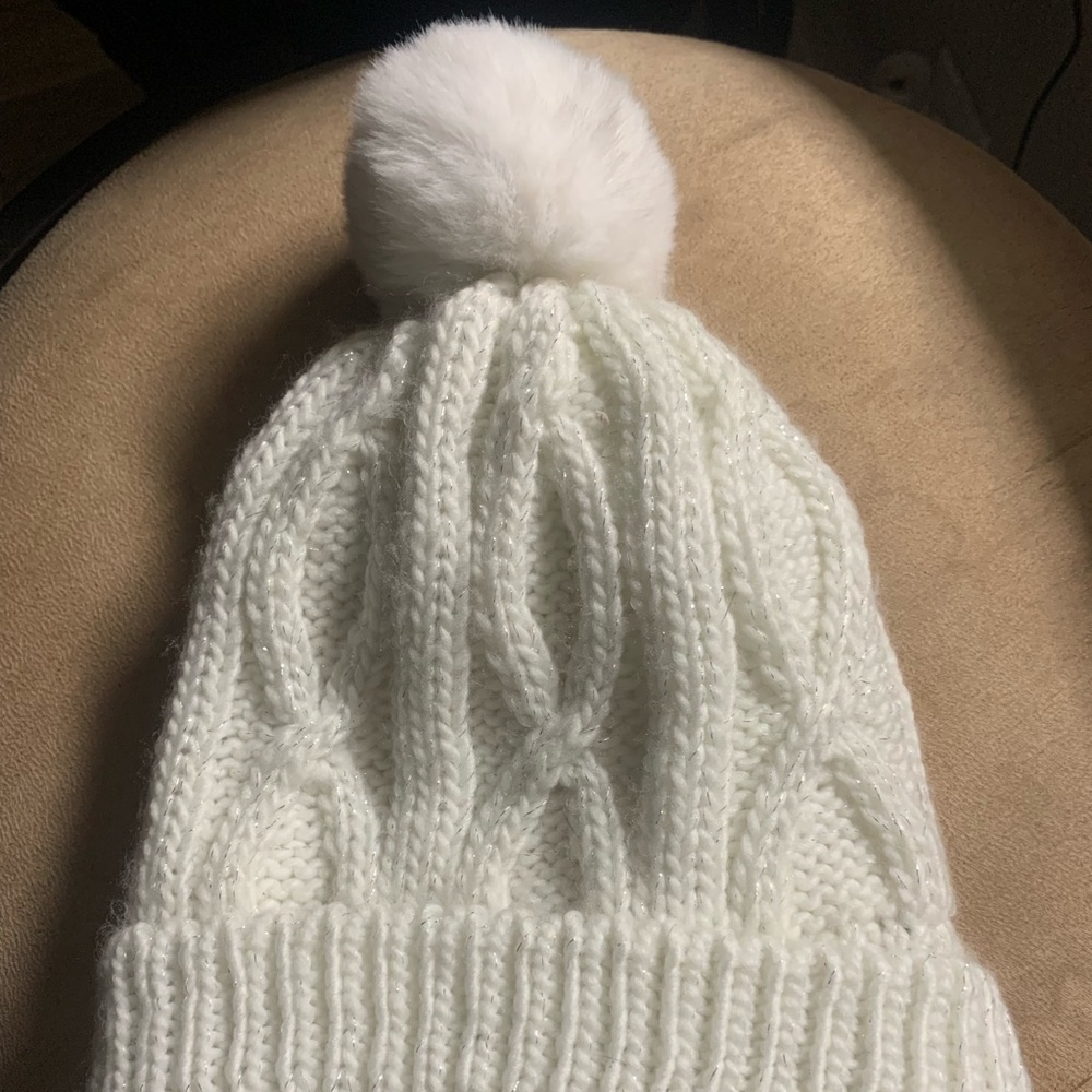 White knit beanie with sparkles.